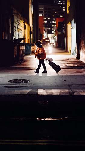 santa monica kid standing while carrying luggage united states